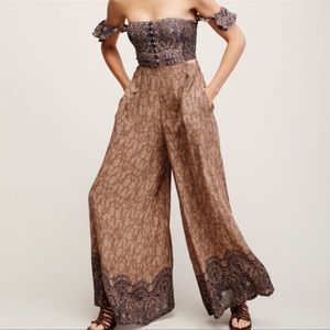 Brand new with tag Free People off shoulder jumpsuit. Size S
